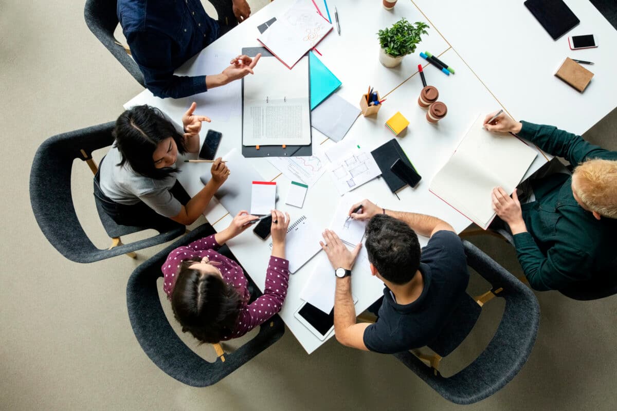 Group of business people working together around a table