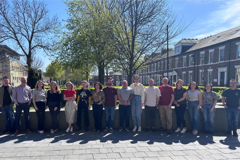 The IGNIFI team stand outside the office in Sunderland