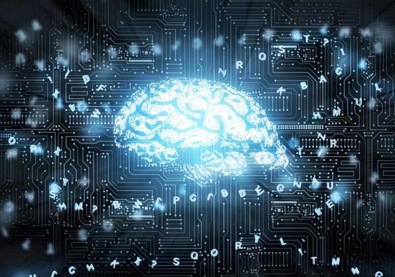 Illustration of a brain with letters around it on a circuit board