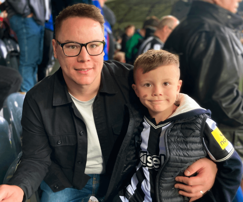 John Mares and his son at a Newcastle United match